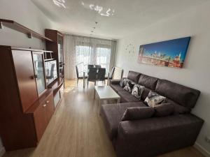 a living room with a couch and a table at Precioso duplex en Oviedo WIFI in Oviedo