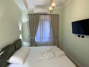 Postel nebo postele na pokoji v ubytování Amorino Tirana B&B