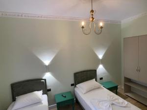 Postel nebo postele na pokoji v ubytování Amorino Tirana B&B
