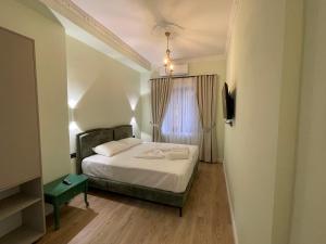 Postel nebo postele na pokoji v ubytování Amorino Tirana B&B