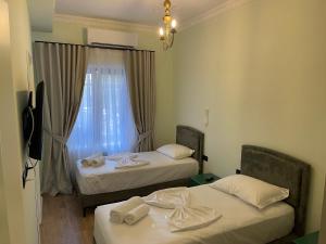 Postel nebo postele na pokoji v ubytování Amorino Tirana B&B