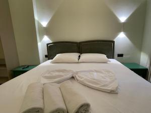 Postel nebo postele na pokoji v ubytování Amorino Tirana B&B