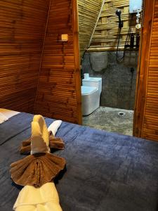 a room with a bed with a shower and a toilet at The Backyard Inn in Moalboal +59 photos