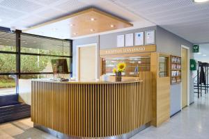 an office with a reception counter in a building at Hostel Linnasmäki in Turku +21 photos