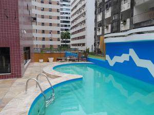 a swimming pool in the middle of a building at FLAT SAINT MARTIN Apto 308 in Fortaleza
