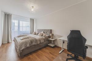 Postel nebo postele na pokoji v ubytování Luxusní Apartmán U Petrofa s vlastním parkovacím místem