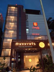 a building with a sign that reads marriott plus vet restaurant at Lords Eco Inn Belagavi in Belgaum