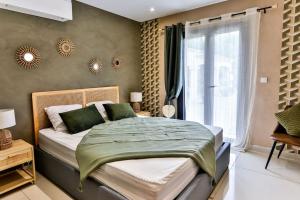 a bedroom with a large bed and a window at Villa Emeraude-Joyaux de Provence in Saint-Étienne-du-Grès +37 photos
