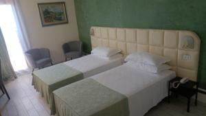 Postel nebo postele na pokoji v ubytování Hotel Delta Florence