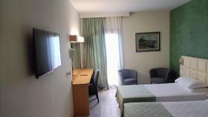 TV a/nebo společenská místnost v ubytování Hotel Delta Florence