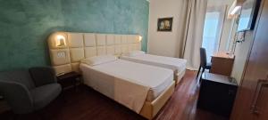Postel nebo postele na pokoji v ubytování Hotel Delta Florence