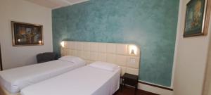 Postel nebo postele na pokoji v ubytování Hotel Delta Florence