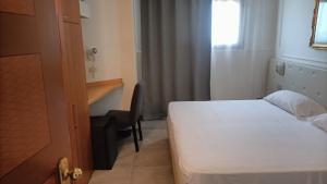 Postel nebo postele na pokoji v ubytování Hotel Delta Florence