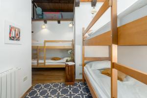 a room with two bunk beds and a rug at Beeindruckende Finca mit Privatpool, Meerblick, Babybett und besonderem Interieur in Vošteni +31 photos