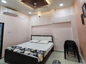 Letto o letti in una camera di Shri Mahaveer Residency