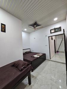 Letto o letti in una camera di Shri Mahaveer Residency