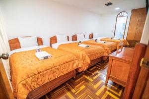Postel nebo postele na pokoji v ubytování Inkas Peru Hostal