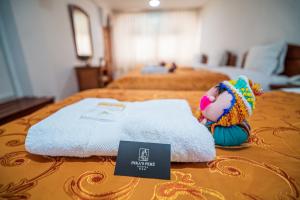 Postel nebo postele na pokoji v ubytování Inkas Peru Hostal