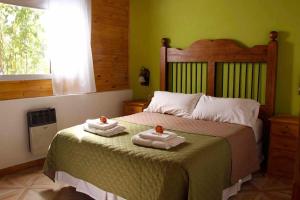 En eller flere senge i et værelse på Cabañas DEL CERRO