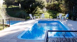 Swimmingpoolen hos eller tæt på Cabañas DEL CERRO