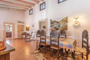 a dining room with a table and chairs at Villa Son Coves by Slow Villas in Santanyi