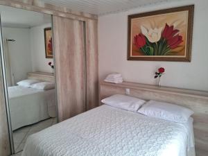 Postel nebo postele na pokoji v ubytování Quarto 03 vó Vera