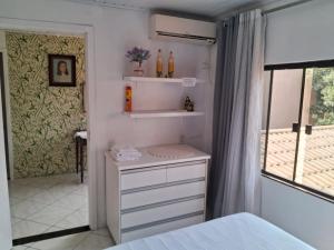 Postel nebo postele na pokoji v ubytování Quarto 03 vó Vera