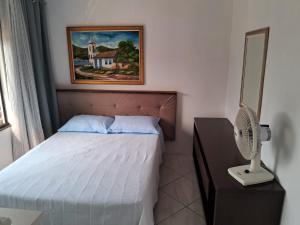 Postel nebo postele na pokoji v ubytování Quarto 03 vó Vera + 5 fotografií