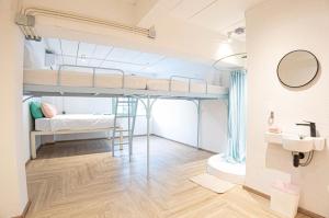 Postel nebo postele na pokoji v ubytování The Greens Khaosan Bangkok + 31 fotografií