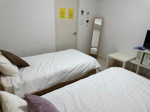 Voodi või voodid majutusasutuse Residence天王寺東 toas
