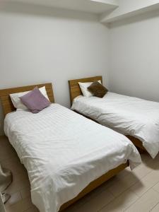 Voodi või voodid majutusasutuse Residence天王寺東 toas