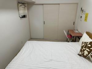 Voodi või voodid majutusasutuse Residence天王寺東 toas