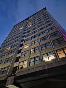 a tall building with lots of windows at Britannia Inn Glasgow in Glasgow