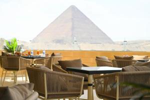 Restavracija oz. druge možnosti za prehrano v nastanitvi Pyramids Wonders Hotel