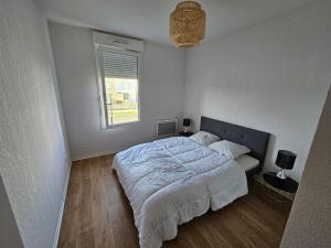 Postel nebo postele na pokoji v ubytování Appartement duplex Mimizan plage
