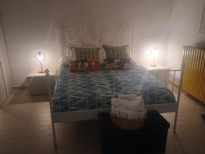 A bed or beds in a room at Terrazza Sui Sassi