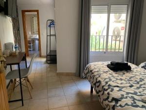 Postel nebo postele na pokoji v ubytování Hostal Casa Michaels