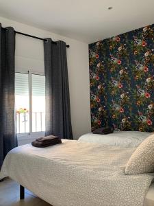 Postel nebo postele na pokoji v ubytování Hostal Casa Michaels