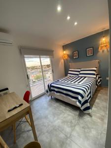 En eller flere senge i et værelse på Departamento Boutique del mar