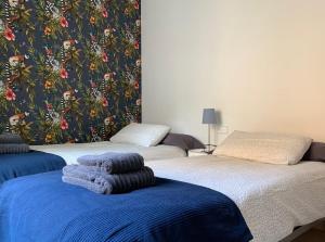 Postel nebo postele na pokoji v ubytování Hostal Casa Michaels
