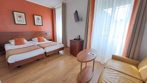 Cama ou camas em um quarto em Hotel International & Terminus