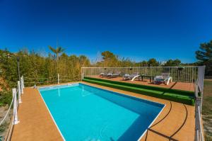 The swimming pool at or close to Ideal Property Mallorca - Can Caragol Font de Sa Cala