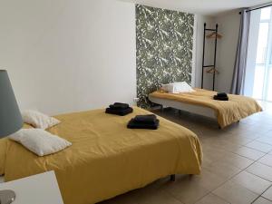 Postel nebo postele na pokoji v ubytování Hostal Casa Michaels