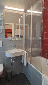 Um banheiro em Hotel International & Terminus