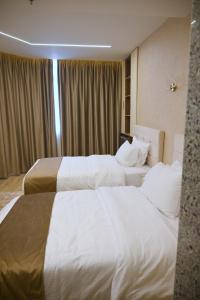 Postelja oz. postelje v sobi nastanitve Pyramids Wonders Hotel