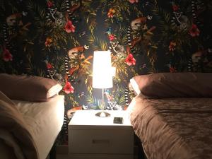 Postel nebo postele na pokoji v ubytování Hostal Casa Michaels