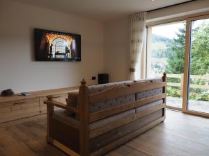 TV a/nebo společenská místnost v ubytování Càbassa Moena by Go new location