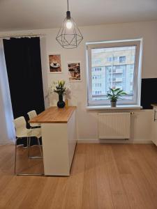 Et tv og/eller underholdning på Apartament Malta & basen ,kort tenisowy w cenie