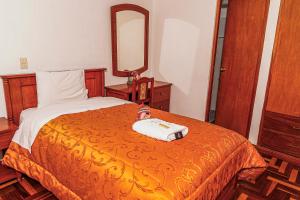 Postel nebo postele na pokoji v ubytování Inkas Peru Hostal