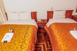 Postel nebo postele na pokoji v ubytování Inkas Peru Hostal